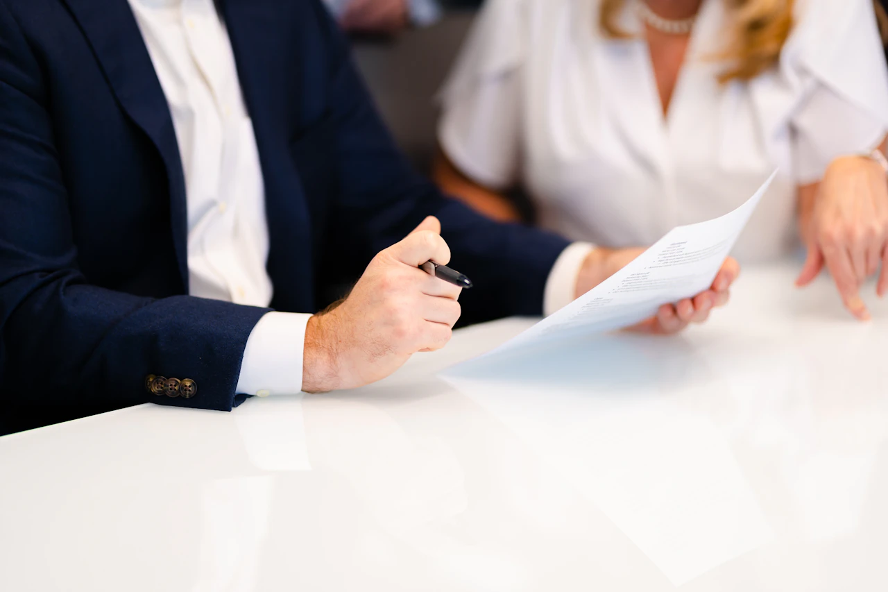A person reviewing a document on a phone
